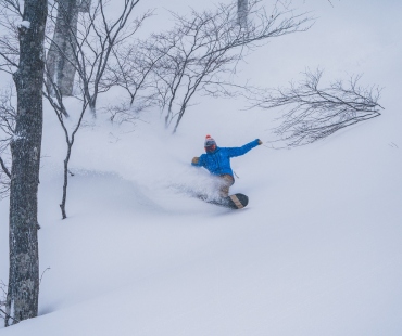 snowboarder in deep powder