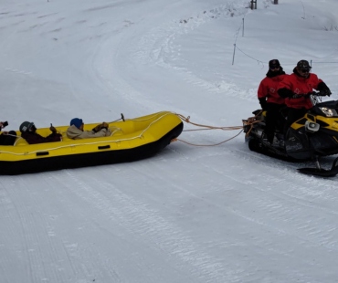 Rafts pulled by snowmobile